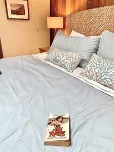 Book titled Sea Ranch on bed
