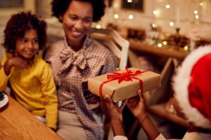 gift exchange , black family mom receiving gift