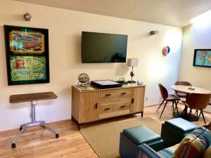 Game room with vintage game in shadow box, TV Sofa
