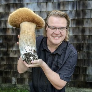 Man holds large mushroom