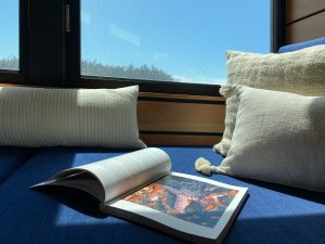 book lies open in the window seat